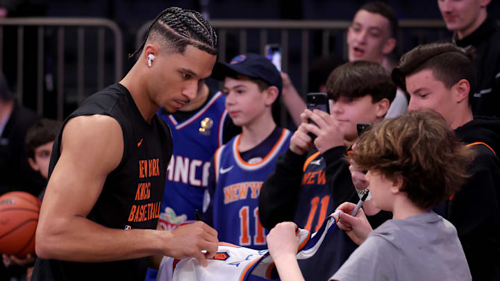 Mar 10, 2024; New York, New York, USA; New York Knicks guard Josh Hart (3) signs autographs for fans before a game against the Philadelphia 76ers at Madison Square Garden. Mandatory Credit: Brad Penner-Imagn Images