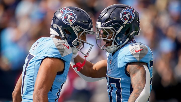 Tennessee Titans wide receiver Chimere Dike (17) celebrates his touchdown against the New England Patriots with running back Tony Pollard (20) during the first quarter at Nissan Stadium in Nashville, Tenn., Sunday, Oct. 19, 2025.