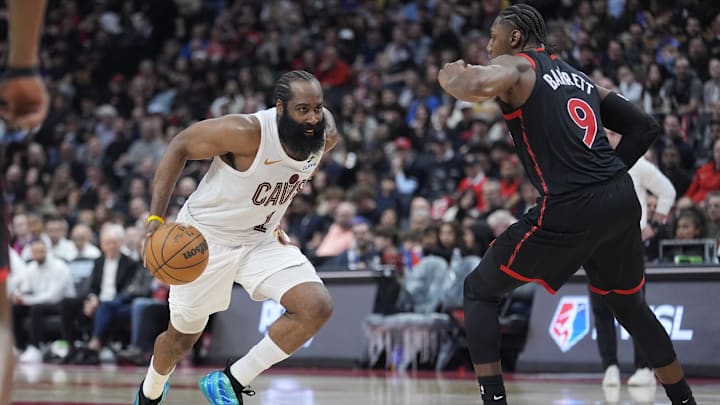 Apr 23, 2026; Toronto, Ontario, CAN; Cleveland Cavaliers guard James Harden (1) drives to the net against Toronto Raptors forward RJ Barrett (9) during the second half of game three of the first round of the 2026 NBA Playoffs at Scotiabank Arena. Mandatory Credit: John E. Sokolowski-Imagn Images