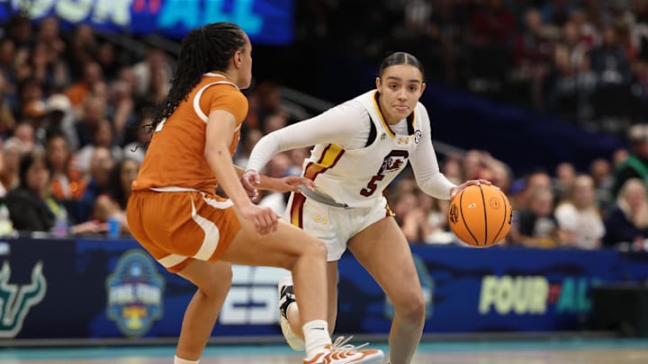 Apr 4, 2025; Tampa, FL, USA; South Carolina Gamecocks guard Tessa Johnson (5) dribbles against Texas Longhorns guard Jordan Lee (7) during the third quarter in a semifinal of the women's 2025 NCAA tournament at Amalie Arena. Mandatory Credit: Nathan Ray Seebeck-Imagn Images Apr 4, 2025; Tampa, FL, USA; South Carolina Gamecocks guard Tessa Johnson (5) dribbles against Texas Longhorns guard Jordan Lee (7) during the third quarter in a semifinal of the women's 2025 NCAA tournament at Amalie Arena. Mandatory Credit: Nathan Ray Seebeck-Imagn Images