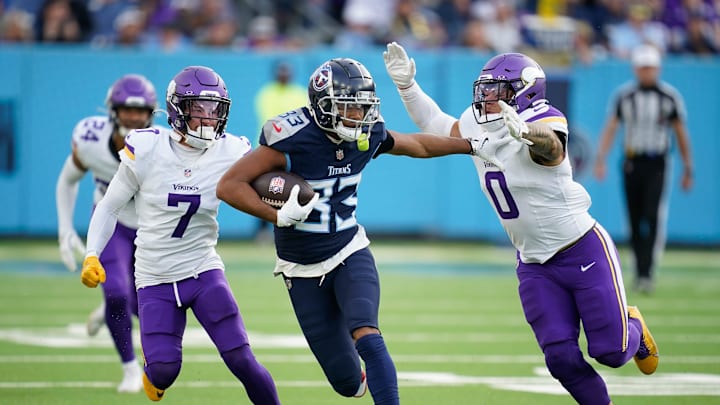 Tennessee Titans wide receiver Tyler Boyd (83) tries to evade Minnesota Vikings linebacker Ivan Pace Jr. (0) during the fourth quarter at Nissan Stadium in Nashville, Tenn., Sunday, Nov. 17, 2024. Tennessee Titans wide receiver Tyler Boyd (83) tries to evade Minnesota Vikings linebacker Ivan Pace Jr. (0) during the fourth quarter at Nissan Stadium in Nashville, Tenn., Sunday, Nov. 17, 2024.