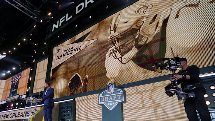 Apr 25, 2025; Green Bay, WI, USA; Former New Orleans Saints tackle Ryan Ramczyk announces the team’s selection with the 40th overall pick during the 2025 NFL Draft at Lambeau Field. Mandatory Credit: Tork Mason/USA Today Network via Imagn Images