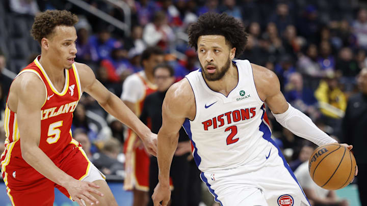 Feb 3, 2025; Detroit, Michigan, USA;  Detroit Pistons guard Cade Cunningham (2) dribbles defended by Atlanta Hawks guard Dyson Daniels (5) in the first half at Little Caesars Arena. Mandatory Credit: Rick Osentoski-Imagn Images