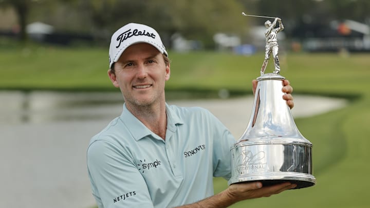 Mar 9, 2025; Orlando, Florida, USA;  Russell Henley holds the champions trophy after winning the Arnold Palmer Invitational golf tournament at Bay Hill. Mandatory Credit: Reinhold Matay-Imagn Images