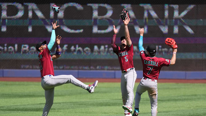 Apr 17, 2025; Miami, Florida, USA; Arizona Diamondbacks left fielder Lourdes Gurriel Jr. (12) center fielder Alek Thomas (5) and right fielder Corbin Carroll (7) celebrate a victory over the Miami Marlins at loanDepot Park. Mandatory Credit: Jim Rassol-Imagn Images Apr 17, 2025; Miami, Florida, USA; Arizona Diamondbacks left fielder Lourdes Gurriel Jr. (12) center fielder Alek Thomas (5) and right fielder Corbin Carroll (7) celebrate a victory over the Miami Marlins at loanDepot Park. Mandatory Credit: Jim Rassol-Imagn Images