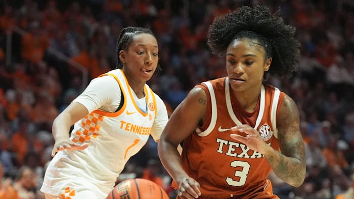 Texas guard Rori Harmon (3) moves the ball while guarded by Tennessee guard Nya Robertson (1) during an NCAA college basketball game on Feb. 15, 2026, in Knoxville, Tennessee.