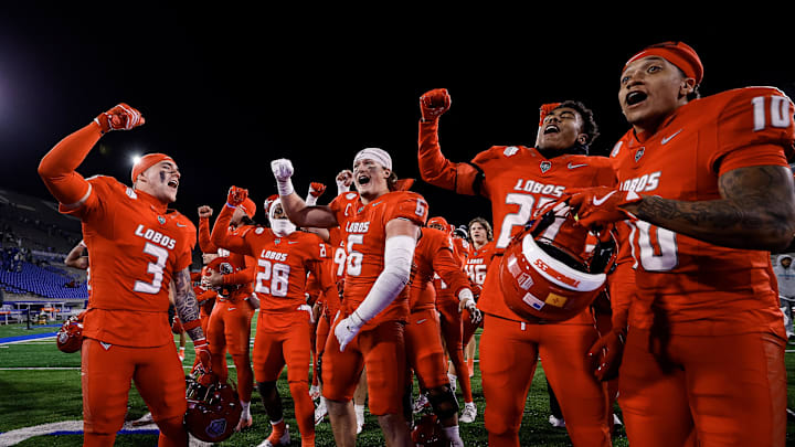 Nov 22, 2025; Colorado Springs, Colorado, USA; New Mexico Lobos players celebrate after the game against the Air Force Falcons at Falcon Stadium. Mandatory Credit: Isaiah J. Downing-Imagn Images