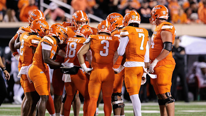 Oct 18, 2025; Stillwater, Oklahoma, USA; Oklahoma State Cowboys huddle during the second half against the Cincinnati Bearcats at Boone Pickens Stadium. Mandatory Credit: William Purnell-Imagn Images