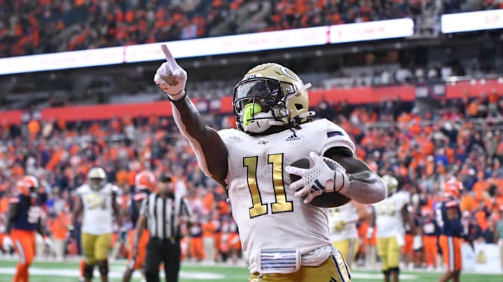 Sep 7, 2024; Syracuse, New York, USA; Georgia Tech Yellow Jackets running back Jamal Haynes (11) scores a touchdown against the Syracuse Orange in the fourth quarter at the JMA Wireless Dome. Mandatory Credit: Mark Konezny-Imagn Images