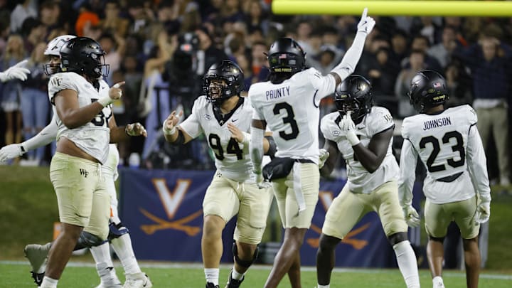 Nov 8, 2025; Charlottesville, Virginia, USA; Wake Forest Demon Deacons players celebrates after recovering a fumble against the Virginia Cavaliers during the first half at Scott Stadium. Mandatory Credit: Amber Searls-Imagn Images