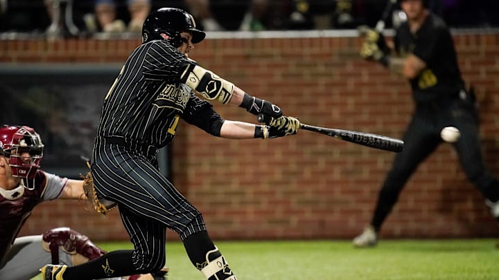 Vanderbilt designated hitter Mac Rose (16) connects for a single against Arkansas during the fifth inning at Hawkins Field in Nashville, Tenn., Friday, March 28, 2025.