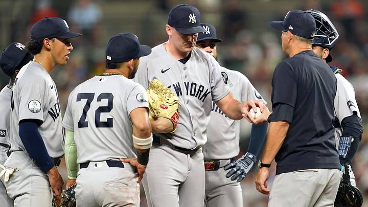Aug 18, 2026; Baltimore, Maryland, USA; New York Yankees pitcher Brent Headrick (center) is removed from the game by manager Aaron Boone (right) during the seventh inning against the Baltimore Orioles at Oriole Park at Camden Yards. Mandatory Credit: Mitch Stringer-Imagn Images Aug 18, 2026; Baltimore, Maryland, USA; New York Yankees pitcher Brent Headrick (center) is removed from the game by manager Aaron Boone (right) during the seventh inning against the Baltimore Orioles at Oriole Park at Camden Yards. Mandatory Credit: Mitch Stringer-Imagn Images