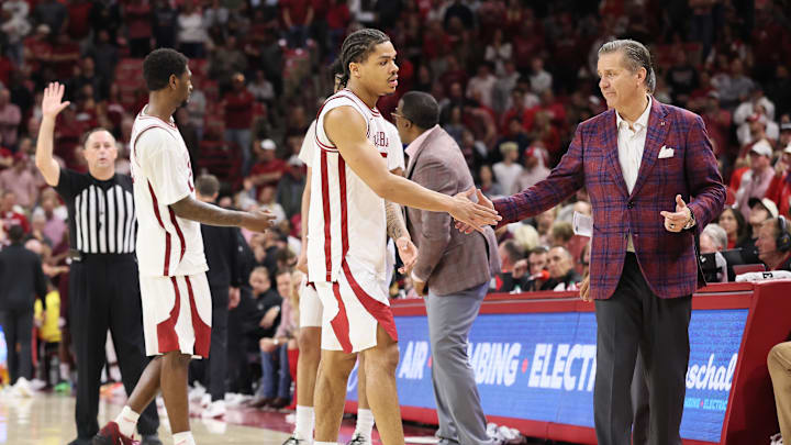 Feb 25, 2026; Fayetteville, Arkansas, USA; Arkansas Razorbacks guard Darius Acuff Jr (5) shakes hands with head coach John Calipari during the second half Texas A&M Aggies at Bud Walton Arena. Arkansas won 99-84. Mandatory Credit: Nelson Chenault-Imagn Images