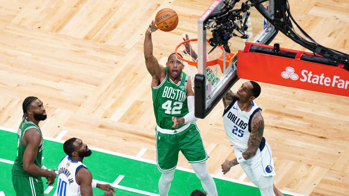 Jun 17, 2024; Boston, Massachusetts, USA; Boston Celtics center Al Horford (42) shoots against Dallas Mavericks forward P.J. Washington (25) in the second half during game five of the 2024 NBA Finals at TD Garden. Mandatory Credit: David Butler II-USA TODAY Sports