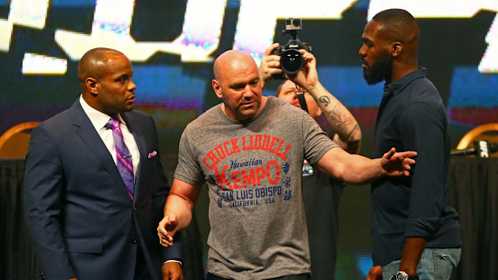 Mar 4, 2016; Las Vegas, NV, USA; UFC president Dana White (center) separates fighter Jon Jones (right) from Daniel Cormier during a press conference prior to weigh-ins for UFC 196 at MGM Grand Garden Arena. Mandatory Credit: Mark J. Rebilas-Imagn Images
