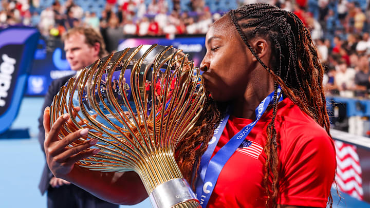 Coco Gauff of Team USA kisses the trophy after beating team Poland in the finals during day ten of the 2025 United Cup.