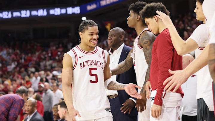 Feb 25, 2026; Fayetteville, Arkansas, USA; Arkansas Razorbacks guard Darius Acuff Jr (5) celebrates with the bench after coming out of the game during the second half Texas A&M Aggies at Bud Walton Arena. Arkansas won 99-84. Mandatory Credit: Nelson Chenault-Imagn Images