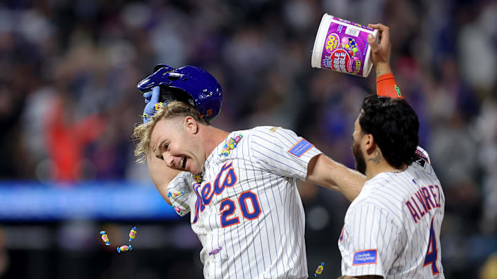 May 12, 2025; New York City, New York, USA; New York Mets first baseman Pete Alonso (20) celebrates with catcher Francisco Alvarez (4) after his ninth inning walkoff RBI sacrifice fly against the Pittsburgh Pirates at Citi Field. Mandatory Credit: Brad Penner-Imagn Images