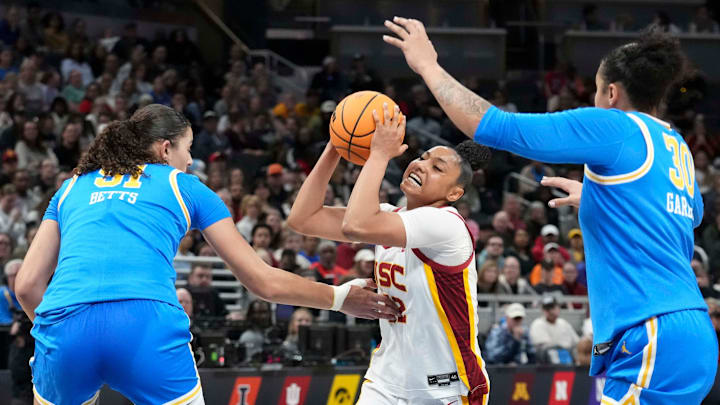 UCLA Bruins center Lauren Betts (51) and forward Timea Gardiner (30) guard USC Trojans guard JuJu Watkins (12) during the second half of the 2025 TIAA Big Ten Women's Basketball Tournament final game on Sunday, March 9, 2025, at Gainbridge Fieldhouse in Indianapolis. UCLA defeated USC 72-67.