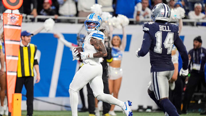 Jahmyr Gibbs scores one of his three touchdowns against the Cowboys. 