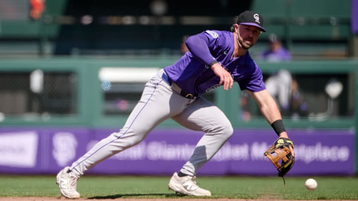May 4, 2025; San Francisco, California, USA; Colorado Rockies second baseman Kyle Farmer (6) fields a ground ball against the San Francisco Giants during the eighth inning at Oracle Park. Mandatory Credit: Robert Edwards-Imagn Images