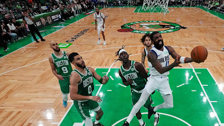 Jun 17, 2024; Boston, Massachusetts, USA; Dallas Mavericks guard Kyrie Irving (11) shoots the ball against Boston Celtics guard Jrue Holiday (4) in game five of the 2024 NBA Finals at TD Garden. Mandatory Credit: Peter Casey-Imagn Images