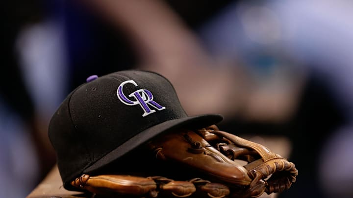 A general view of a Colorado Rockies hat and glove in the sixth inning of the game against the Arizona Diamondbacks at Coors Field in 2017.