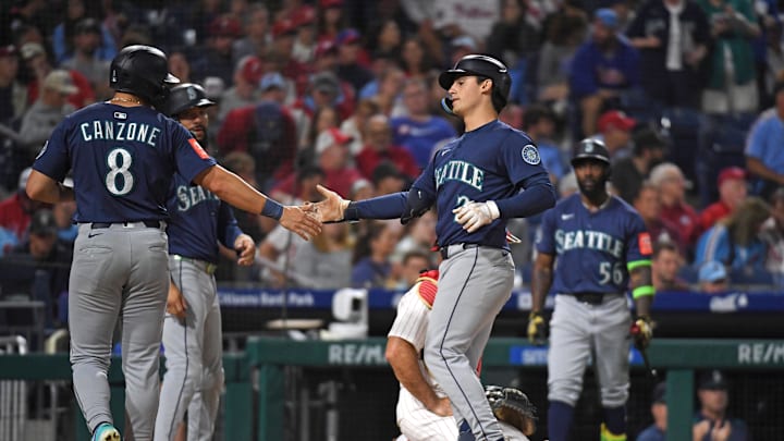 Aug 18, 2025; Philadelphia, Pennsylvania, USA; Seattle Mariners second base Cole Young (2) celebrates his three-run home run with outfielder Dominic Canzone (8) during the seventh inning against the Philadelphia Phillies at Citizens Bank Park. Mandatory Credit: Eric Hartline-Imagn Images