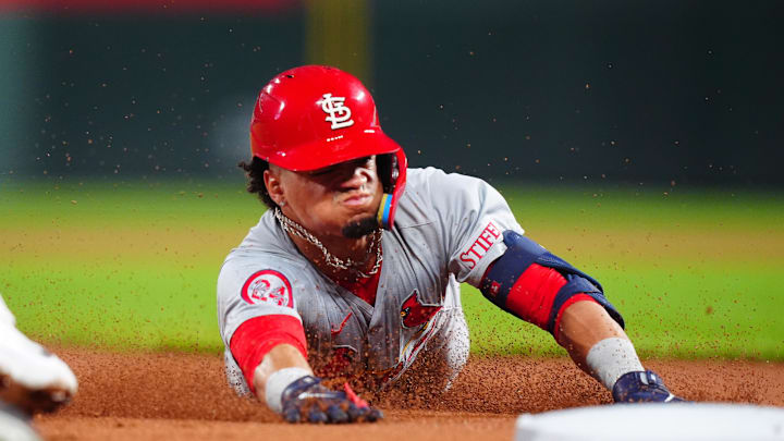 St. Louis Cardinals shortstop Masyn Winn (0) slides for a triple in the third inning against the Colorado Rockies at Coors Field in 2024.