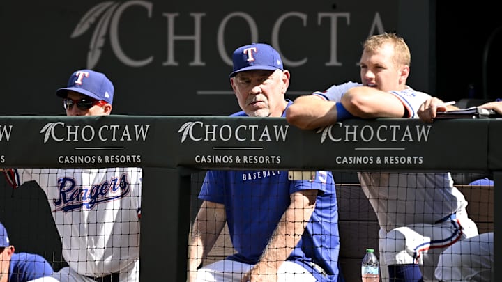 Sep 25, 2025; Arlington, Texas, USA; Texas Rangers manager Bruce Bochy (center) looks on from the dugout during the game against the Minnesota Twins at Globe Life Field. Mandatory Credit: Jerome Miron-Imagn Images Sep 25, 2025; Arlington, Texas, USA; Texas Rangers manager Bruce Bochy (center) looks on from the dugout during the game against the Minnesota Twins at Globe Life Field. Mandatory Credit: Jerome Miron-Imagn Images