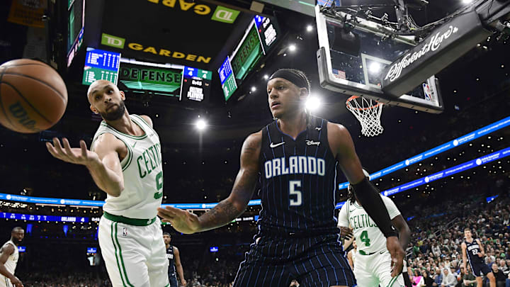 Apr 20, 2025; Boston, Massachusetts, USA; Boston Celtics guard Derrick White (9) tries to save the ball from going out of bounds after Orlando Magic forward Paolo Banchero (5) loses control during the first half at TD Garden. Mandatory Credit: Bob DeChiara-Imagn Images Apr 20, 2025; Boston, Massachusetts, USA; Boston Celtics guard Derrick White (9) tries to save the ball from going out of bounds after Orlando Magic forward Paolo Banchero (5) loses control during the first half at TD Garden. Mandatory Credit: Bob DeChiara-Imagn Images