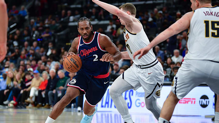 Los Angeles Clippers forward Kawhi Leonard (2) moves the ball against Denver Nuggets guard Christian Braun (0) during the second half of game three in the first round for the 2024 NBA Playoffs at Intuit Dome. Mandatory Credit: Gary A. Vasquez-Imagn Images