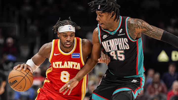 Mar 23, 2026; Atlanta, Georgia, USA; Atlanta Hawks guard Buddy Hield (8) dribbles against Memphis Grizzlies forward GG Jackson (45) during the second half at State Farm Arena. Mandatory Credit: Dale Zanine-Imagn Images