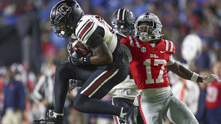 Nov 1, 2025; Oxford, Mississippi, USA; South Carolina Gamecocks defensive back Jalon Kilgore (24) intercepts a pass intended for Mississippi Rebels wide receiver Winston Watkins (17) during the second quarter at Vaught-Hemingway Stadium. Mandatory Credit: Petre Thomas-Imagn Images