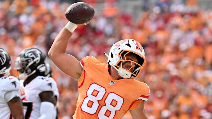 Oct 27, 2024; Tampa, Florida, USA; Tampa Bay Buccaneers tight end Cade Otton (88) spikes the ball after scoring a touchdown in the first half  against the Atlanta Falcons at Raymond James Stadium. Mandatory Credit: Jonathan Dyer-Imagn Images
