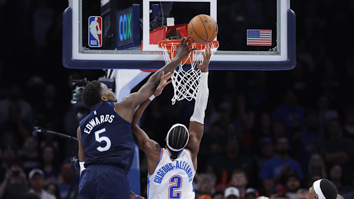 Feb 24, 2025; Oklahoma City, Oklahoma, USA; Minnesota Timberwolves guard Anthony Edwards (5) blocks a shot by Oklahoma City Thunder guard Shai Gilgeous-Alexander (2) during the second half at Paycom Center. Mandatory Credit: Alonzo Adams-Imagn Images