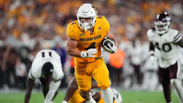 Arizona State running back Cam Skattebo (4) runs the ball against the Mississippi State Bulldogs at Mountain America Stadium in Tempe on Sept. 7, 2024.