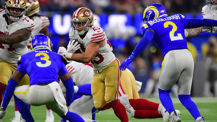 Oct 2, 2025; Inglewood, California, USA; San Francisco 49ers running back Christian McCaffrey (23) rushes the ball against Los Angeles Rams safety Kam Curl (3) during the first half at SoFi Stadium. Mandatory Credit: Gary A. Vasquez-Imagn Images Oct 2, 2025; Inglewood, California, USA; San Francisco 49ers running back Christian McCaffrey (23) rushes the ball against Los Angeles Rams safety Kam Curl (3) during the first half at SoFi Stadium. Mandatory Credit: Gary A. Vasquez-Imagn Images