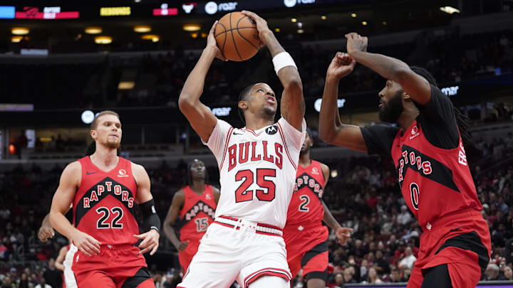 Oct 17, 2023; Chicago, Illinois, USA; Toronto Raptors guard Javon Freeman-Liberty (0) defends Chicago Bulls forward Dalen Terry (25) during the second half at United Center. Mandatory Credit: David Banks-Imagn Images