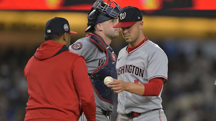 Jun 20, 2025; Los Angeles, California, USA;  Washington Nationals starting pitcher MacKenzie Gore (1) is pulled by manager Dave Martinez (4) in the sixth inning after giving up a two run home run to Los Angeles Dodgers second baseman Miguel Rojas (72) in the sixth inning at Dodger Stadium. 