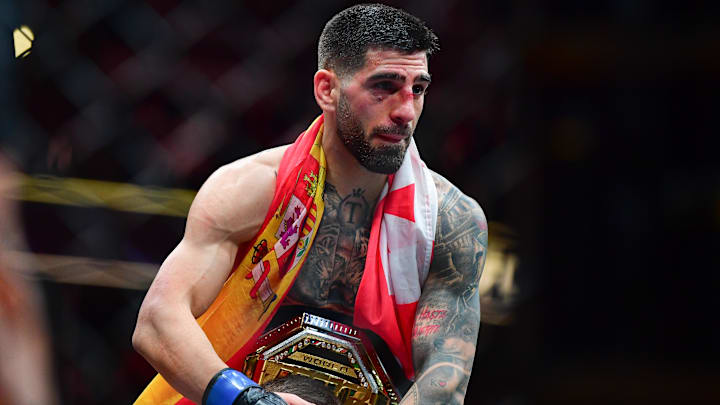 Feb 17, 2024; Anaheim, California, USA; Ilia Topuria celebrates his championship victory against Alexander Volkanovski.