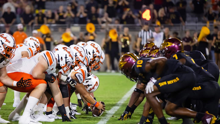 Sep 9, 2023; Tempe, Arizona, USA; General view down the line of scrimmage as Oklahoma State Cowboys long snapper Zeke Zaragoza (63) prepares to snap the ball against the Arizona State Sun Devils at Mountain America Stadium. Mandatory Credit: Mark J. Rebilas-Imagn Images Sep 9, 2023; Tempe, Arizona, USA; General view down the line of scrimmage as Oklahoma State Cowboys long snapper Zeke Zaragoza (63) prepares to snap the ball against the Arizona State Sun Devils at Mountain America Stadium. Mandatory Credit: Mark J. Rebilas-Imagn Images