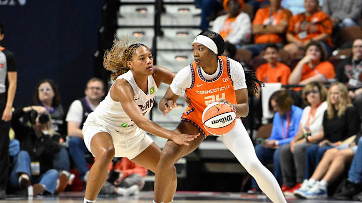 Sep 10, 2025; Uncasville, Connecticut, USA; Atlanta Dream forward Naz Hillmon (00) defends against Connecticut Sun forward Aneesah Morrow (24) during the first half at Mohegan Sun Arena. Eric Canha-Imagn Images