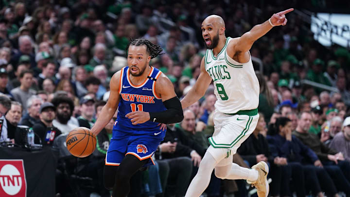 May 5, 2025; Boston, Massachusetts, USA; New York Knicks guard Jalen Brunson (11) returns the ball against Boston Celtics guard Derrick White (9) in the second quarter during game one of the second round for the 2025 NBA Playoffs at TD Garden. Mandatory Credit: David Butler II-Imagn Images