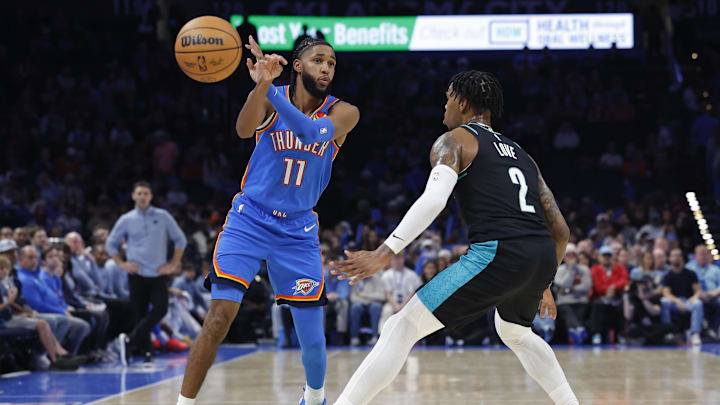 Nov 23, 2025; Oklahoma City, Oklahoma, USA; Oklahoma City Thunder guard Isaiah Joe (11) passes the ball beside Portland Trail Blazers guard Caleb Love (2) during the second half at Paycom Center. Mandatory Credit: Alonzo Adams-Imagn Images