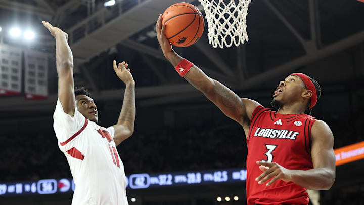 Dec 3, 2025; Fayetteville, Arkansas, USA; Louisville Cardinals guard Ryan Conwell (3) shoots against Arkansas Razorbacks wing Karter Knox (11) during the second half at Bud Walton Arena. Arkansas won 89-80. Mandatory Credit: Nelson Chenault-Imagn Images