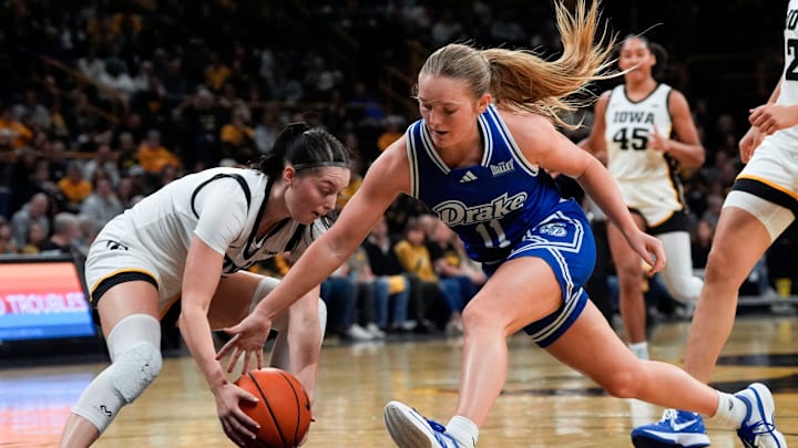 Iowa guard Taylor McCabe (2) and Drake guard Peyton McCabe (11) reach for a loose ball Nov. 13, 2025 at Carver-Hawkeye Arena in Iowa City, Iowa. Iowa guard Taylor McCabe (2) and Drake guard Peyton McCabe (11) reach for a loose ball Nov. 13, 2025 at Carver-Hawkeye Arena in Iowa City, Iowa.