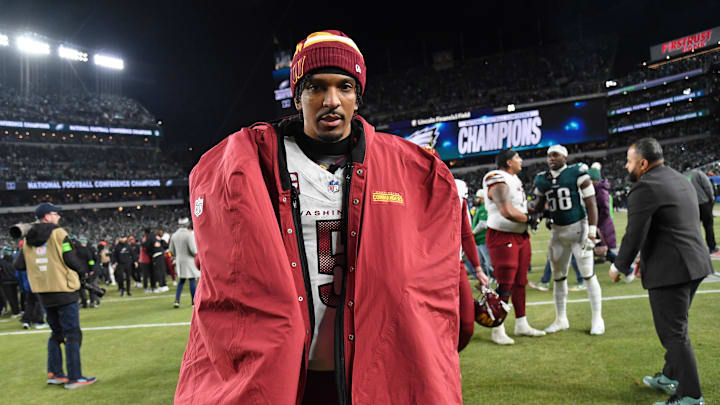 Jan 26, 2025; Philadelphia, PA, USA; Washington Commanders quarterback Jayden Daniels (5) walks off the field after losing the NFC Championship game against the Philadelphia Eagles at Lincoln Financial Field. Mandatory Credit: Eric Hartline-Imagn Images