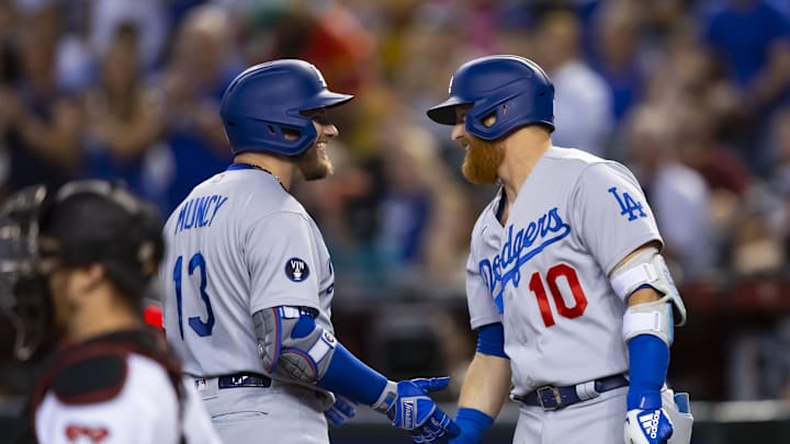 Sep 13, 2022; Phoenix, Arizona, USA; Los Angeles Dodgers infielder Max Muncy (left) celebrates with teammate Justin Turner after hitting a solo home run in the seventh inning against the Arizona Diamondbacks at Chase Field. Mandatory Credit: Mark J. Rebilas-Imagn Images Sep 13, 2022; Phoenix, Arizona, USA; Los Angeles Dodgers infielder Max Muncy (left) celebrates with teammate Justin Turner after hitting a solo home run in the seventh inning against the Arizona Diamondbacks at Chase Field. Mandatory Credit: Mark J. Rebilas-Imagn Images