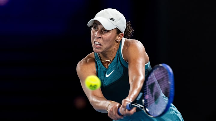 Jan 24, 2025; Melbourne, Victoria, Australia; Madison Keys of United States of America plays a backhand during her match against Iga Swiatek of Poland in the semifinals of the women's singles at the 2025 Australian Open at Melbourne Park. Mandatory Credit: Mike Frey-Imagn Images